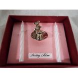 A silver hallmarked christening gift set, a silver candle holder, with teddy bear,