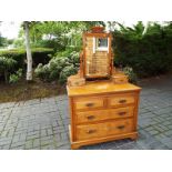 A chest of two over two drawers with brass drop handles (see also lot 56)