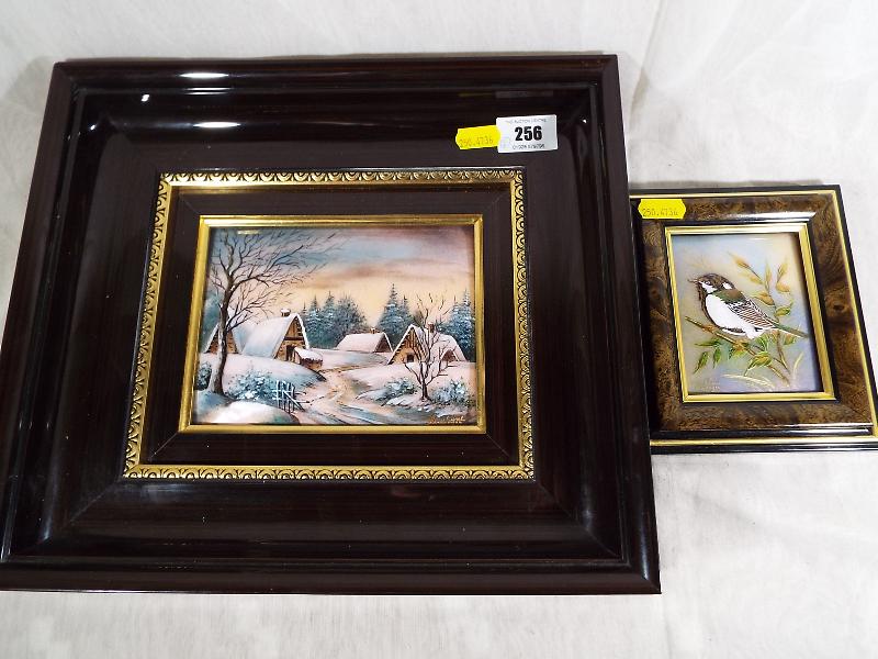 Two hand painted Emaux d'art Delimoges framed pictures one depicting a winter's scene,