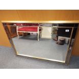 A good quality gilt framed with mirror back smoked detail bevel edged wall mirror,