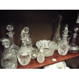 A good collection of cut glass to include five decanters, a preserve dish,