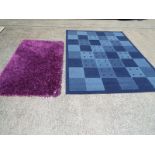 Two rugs, one with blue check, approx size 170cm x 230cm and another purple,