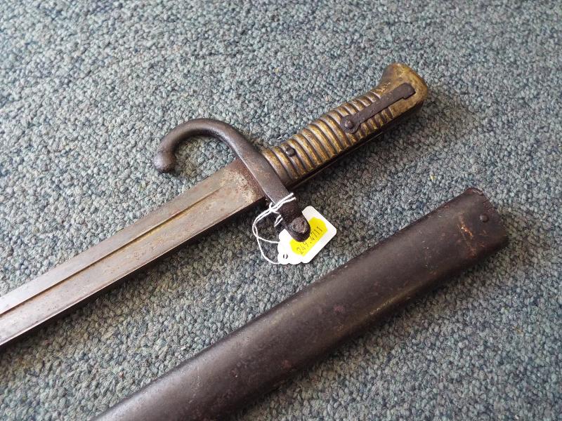 A 19th century French curved sword bayonet with brass handle and metal scabbard, - Image 3 of 4