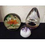 Three good quality glass paperweights to include Ciic and other (3)