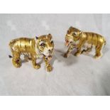 Two hand painted figurines depicting African Tigers, 7.