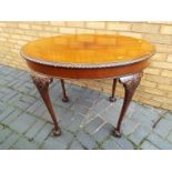 A good quality oval mahogany side table cabriole supports terminating in ball and claw feet