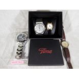 Four wristwatches two include an Executive Elite watch (unused),