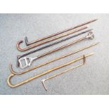 Approx six walking sticks, shooting stick,