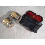 A pair of opera glasses by Negretti & Zambra of London,