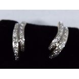 A pair of lady's 9ct gold earring stone set with diamonds