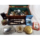 A small wooden chest containing a quantity of costume jewellery, designer wristwatches,