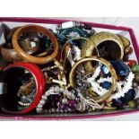 A box containing a quantity of unsorted costume jewellery