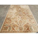 A floral patterned rug on a cream ground,