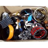 A box containing a quantity of unsorted costume jewellery