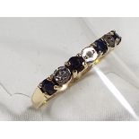 A lady's 9ct gold half eternity ring, set with sapphire and diamond, size Q1/2, approx weight 1.