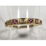 A lady's 9ct gold half eternity ring, set with ruby and diamond, size N1/2, approx weight 1.