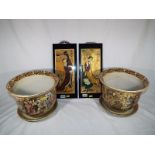 A pair of Chinese jardinieres with drip trays,
