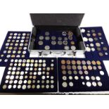 A small metal flight case with fitted interior containing five trays of coins,