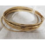 A selection of seven 9ct gold lady's bangles total weight approx 23.