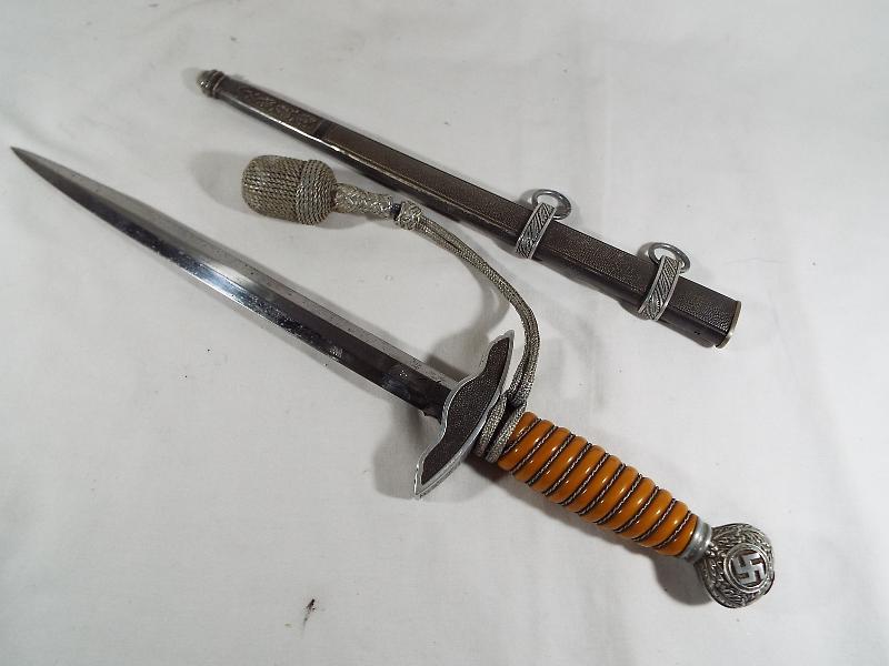 A Third Reich German Luftwaffe dagger with woven white metal wire bound orange celluloid grip, - Image 3 of 9