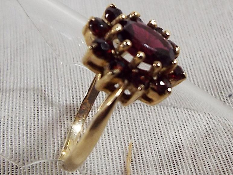 A lady's hallmarked 9ct yellow gold garnet cluster ring, approx weight 2. - Image 2 of 2