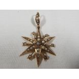 A 9ct gold star shaped pendant set with pearl, approx weight 2.