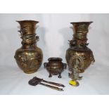 A collection of Chinese and Indian metal items including brass dragon vases,