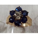 A lady's 9ct yellow gold sapphire and illusion set diamond cluster, approx weight 2.