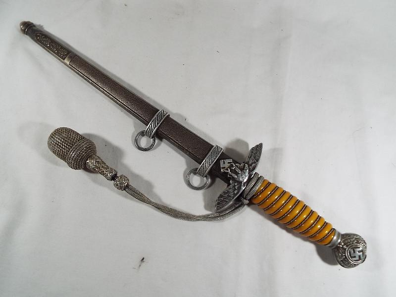 A Third Reich German Luftwaffe dagger with woven white metal wire bound orange celluloid grip, - Image 2 of 9