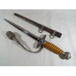 A Third Reich German Luftwaffe dagger with woven white metal wire bound orange celluloid grip,