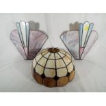 A pair of Tiffany style wall lights and a Tiffany style lamp shade