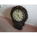 A mid-19th century drop dial wall clock in an ebonised finish,