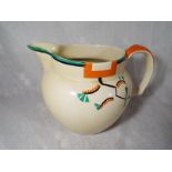 A Clarice Cliff large water / milk jug decorated in the Ravel pattern, 14.