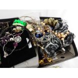 A collection of predominantly costume jewellery to include bangles, necklaces,