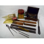 A quantity of vintage drawing instruments to include a Rabone 33ft measuring tape (boxed),