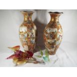 A pair of Oriental baluster vases with flared rims decorated in a figural design, 38cm (h),