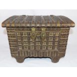 A good quality lidded chest with applied brass panelling, twin handles,