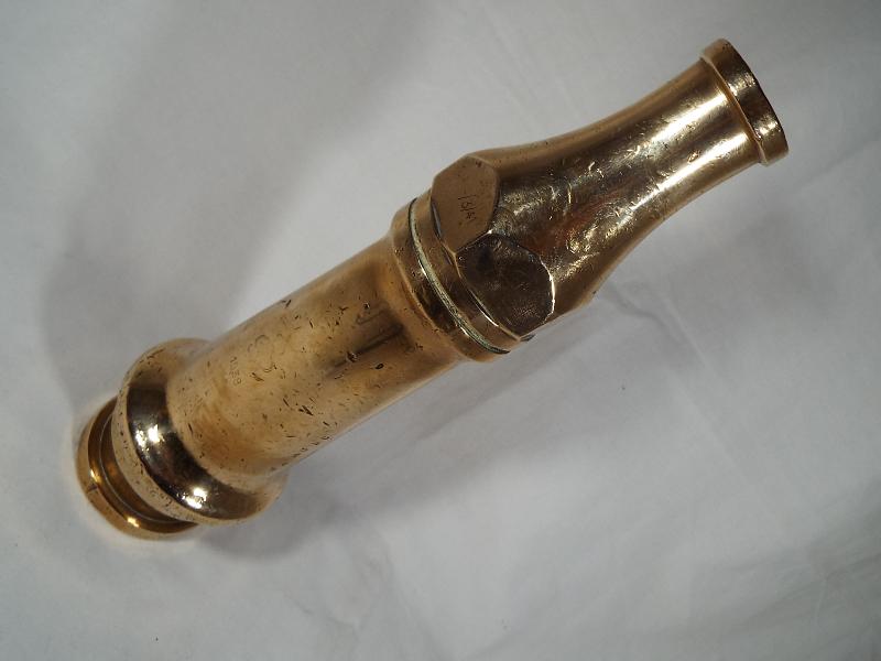 Fire Service - a heavy brass nozzle from a vintage fire hose, stamped GR wth crown above,