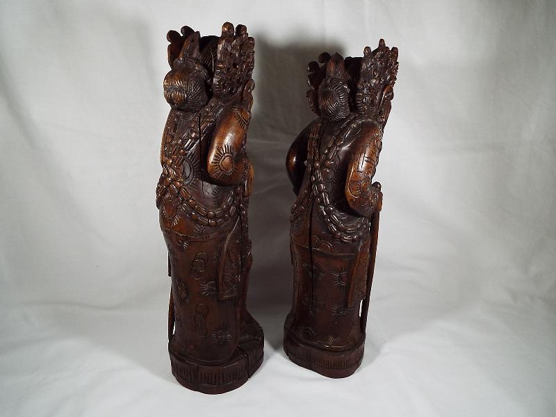 A pair of Oriental figural carvings depicting Chinese characters, 35. - Image 3 of 3