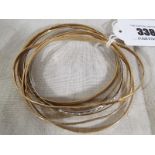 A selection of seven 9ct gold lady's bangles total weight approx 27.