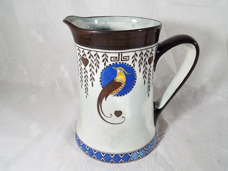 A Royal Doulton jug decorated in the Titanian pattern,