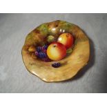 A Royal Worcester small pedestal bowl hand painted with fallen fruits, signed Moseley, 11.