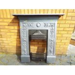 A period cast iron fire surround 106 cm x 96 cm x 16 cm,