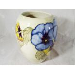 A Moorcroft Pottery large baluster vase decorated with pansies on a pale yellow ground,