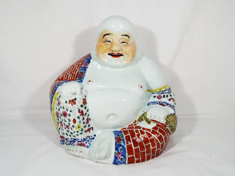 A Chinese famille rose Buddha (laughing) with prayer beads, polychrome finish,