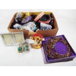 A collection of predominantly costume jewellery to include necklaces, bangles,
