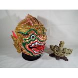 A Bolonese brightly coloured paper mache mask, on stand,