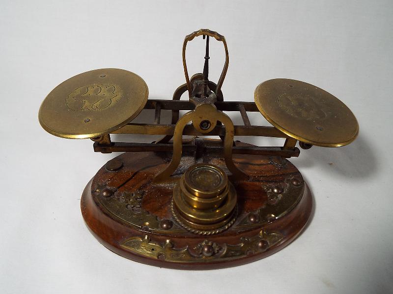 A set of period postal scales and weights,