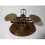 A set of period postal scales and weights,