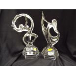 A pair of Art Deco style clear glass figurines depicting female figures